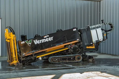 2021 Vermeer D23x30 S3 HDD rig, side angle, drill frame angled up, rubber tracks, yellow hydraulics, pipe loader visible