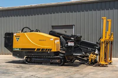 2021 Vermeer D24x40 S3 HDD drill, 3/4 driver-side view, yellow bodywork, rubber tracks, loaded drill pipe carousel, anchor system visible