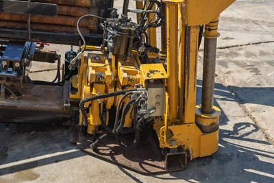 Vermeer D36x50 Series II drill rod vise assembly, hydraulic components, and anchor stake detail in high-angle perspective.