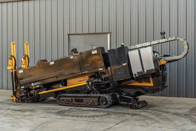 2016 Vermeer D23x30 S3 HDD drill, driver-side view, rubber tracks, yellow hydraulic cylinders, cable carrier, drill frame angled up