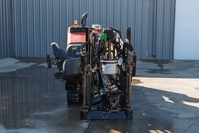 2020 Ditch Witch JT10 HDD rig rear view with operator cab, engine compartment, drill head assembly, and hydraulic controls visible