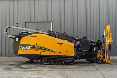 2016 Vermeer D23x30 S3 Navigator HDD drill, full driver-side profile, rubber tracks, drill pipe loaded, hydraulic anchors visible