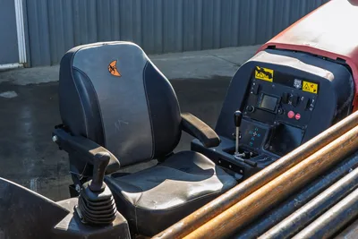 Ditch Witch JT10 operator cab interior with control panel, joystick, seat, and instrumentation