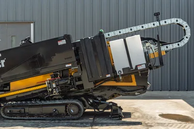2022 Vermeer D23x30 S3 HDD drill side profile showing elevated drill frame, cable carrier, rubber tracks, and fluid tank