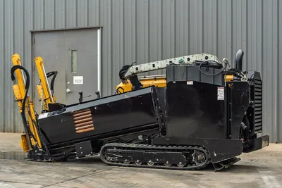 2018 Vermeer D8x12 HDD drill, side profile, angled drill frame raised, rubber tracks, black engine enclosure, yellow hydraulics visible