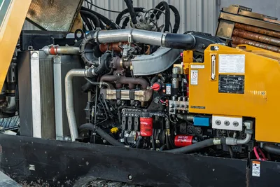2019 Vermeer D40x55 S3 open engine compartment showing turbocharged diesel, hydraulic manifold, radiator, and Baldwin filters