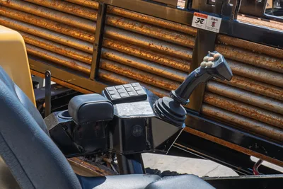 2020 Vermeer D24x40 S3 operator console, joystick controls, keypad, armrest; used drill pipe rack visible behind seat