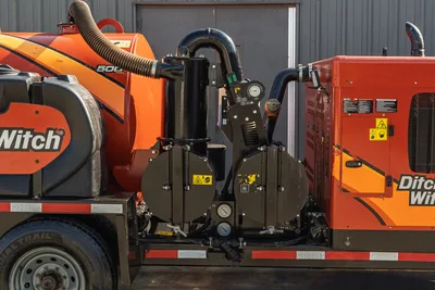 2022 Ditch Witch HX30 mud recycler pump assembly, close-up of centrifugal shaker unit, plumbing, gauges, and 500-gal tank on trailer