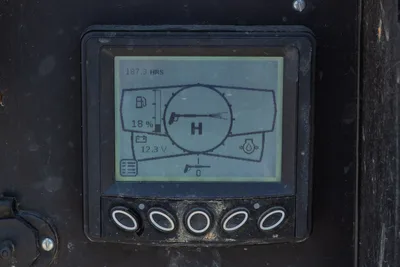 2023 Ditch Witch HX30 digital display panel showing 187.3 hours, 18% fuel, 12.3V battery, function buttons below