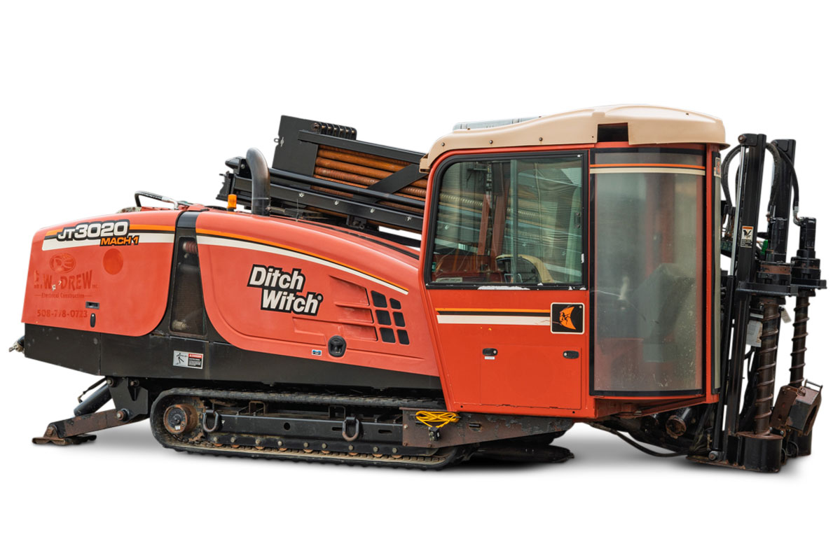 2012 Ditch Witch JT3020 Mach 1 HDD drill, profile view, showing tracks, cab, and drill pipe rack in good condition.
