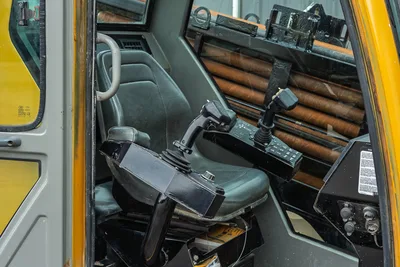 2017 Vermeer 40x55 S3 cab interior showing operator seat, dual joystick controls, and drill pipe rack storage visible.