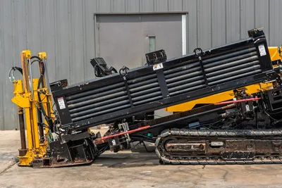2014 Vermeer 24x40 Series II HDD drill rig showing side profile of drill pipe rack, rack assembly, tracks, and hydraulics.