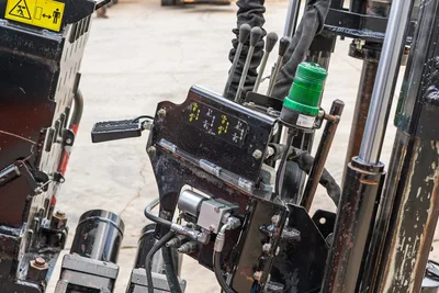 2021 Ditch Witch JT28 operator control panel with hydraulic levers, green warning beacon, and labeled function decals
