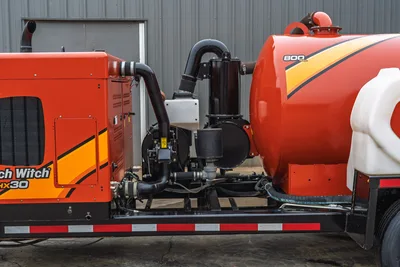 2019 Ditch Witch HX30 vacuum excavator side profile showing 800-gallon spoil tank, engine compartment, and piping system.