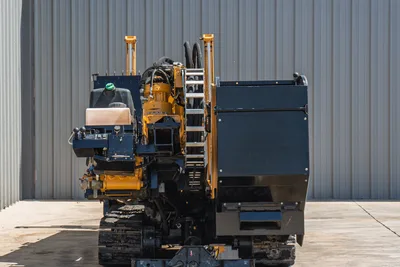2020 Vermeer D24x40 S3 HDD drill, rear view showing carriage, hydraulic system, pipe rack, operator controls, and rubber tracks