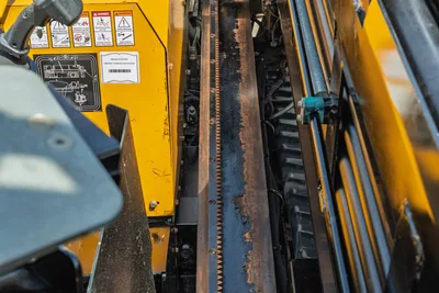 2022 Vermeer D23x30 S3 HDD drill rack closeup showing rack-and-pinion drive, hydraulic cylinder, and VIN label