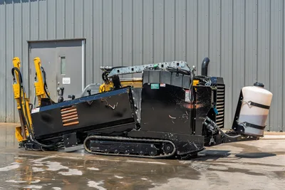 2021 Vermeer D8x12 HDD drill, 3/4 rear angle, rubber tracks, diesel engine compartment, hydraulic carriage, yellow anchors, fluid tank visible