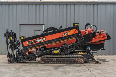 2021 Ditch Witch JT25 horizontal directional drill, side profile view showing rack, drill pipe, tracks, and engine deck.