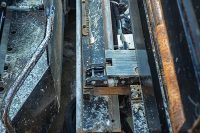 2021 Vermeer D23x30 S3 drill carriage close-up showing rack-and-pinion thrust mechanism, vise jaw assembly, and wear-marked steel frame rails