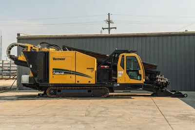 2017 Vermeer D100x140 S3 HDD drill, full right-side profile, enclosed cab, loaded drill pipe rack, crawler tracks, carriage assembly visible