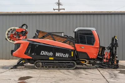 2021 Ditch Witch AT40 HDD in side profile showing tracks, enclosed cab, engine compartment, drill pipe rack, and carriage.