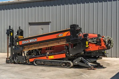 2021 Ditch Witch JT20 horizontal directional drill, side view showing tracks, drill pipe rack, and carriage components.
