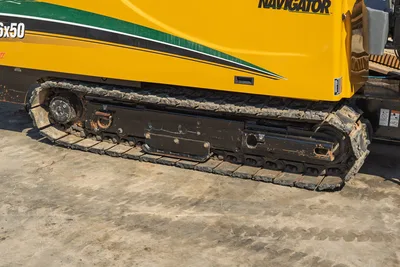 2009 Vermeer D36x50 Series II side profile focusing on the well-maintained metal undercarriage and heavy-duty rubber tracks.