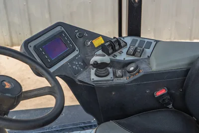 2024 Ditch Witch RT125Q operator console with digital display, joystick, toggle switches, steering wheel, and seat