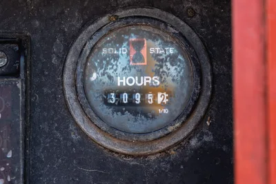 2015 International 7400 mud truck solid state hour meter close-up reading 3,095.2 hours, worn housing