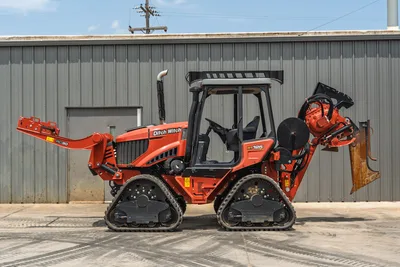 2024 Ditch Witch RT125Q track trencher, full cab, RC30 vibratory plow front attachment, rear chain trencher, side profile view