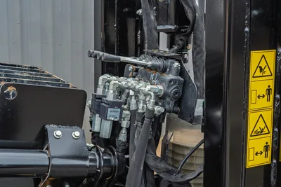 Ditch Witch JT20 rotary head, drill pipe connection, and hydraulic manifold assembly close-up