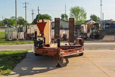2016 Belshe WB14-2EP trailer with 2020 Ditch Witch FM5x mixing system, outdoor facility, front 3/4 view.