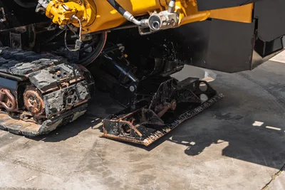 2020 Vermeer D24x40 S3 close-up of rubber track, hydraulic anchor plate, and stabilizer foot with wear from use