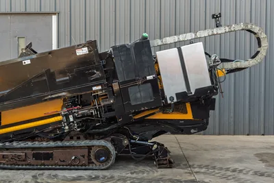 2016 Vermeer D23x30 S3 HDD drill rear quarter view showing hydraulic cable carrier, fluid tanks, engine compartment, and rubber tracks