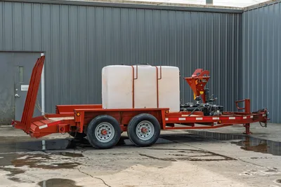2019 Belshe WB14-2EP mud mixing trailer, driver-side view, red steel frame, white poly water tank, Ditch Witch mixer, tandem axle