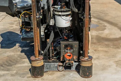 Rear view of 2018 Ditch Witch JT20 drill frame, showing stabilizer legs, hydraulic carriage, and central rotation drive.