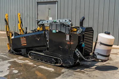 2021 Vermeer D8x12 HDD drill, 3/4 rear view, rubber tracks, engine compartment open, coolant tank, exhaust stack, drill pipe rack visible