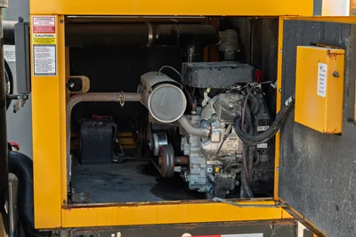 2024 Vermeer LP573SGT vacuum excavator engine compartment with Kohler engine, air filter, muffler, and battery, open view.