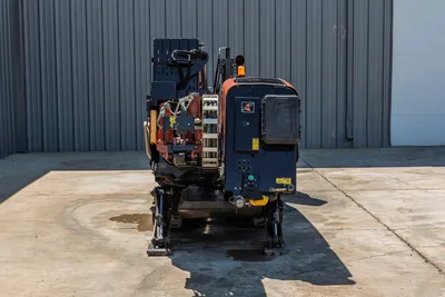 Rear view of 2018 Ditch Witch JT20 HDD drill, showing engine compartment, stabilizers, and pipe rack assembly.