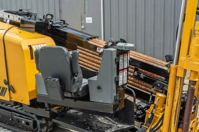 2024 Vermeer D20x22 S3 operator seat, drill pipe rack loaded with used 1.90" HDD rods, yellow chassis, side profile