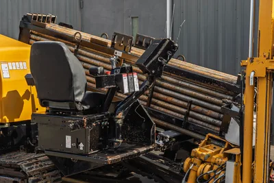 2018 Vermeer D24x40 S3 operator seat, controls, pipe rack loaded with 2.375" drill pipe, and hydraulic components