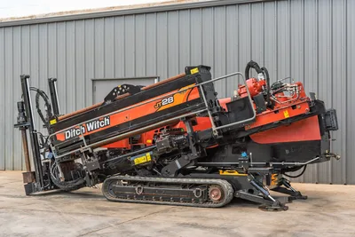 2021 Ditch Witch JT28 HDD drill, driver-side angle, carriage raised, rubber tracks, hydraulics, drill rod visible, used condition