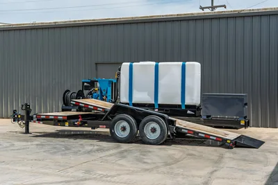 Behnke TBCT2220ET-BT-R HDD mud mixing trailer, tandem axle, white poly tank with blue straps, blue mixer unit, hose reel, tool box, wood deck