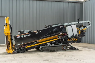 2024 Vermeer D20x22 S3 HDD drill, side profile, drill frame angled up, rubber tracks, yellow hydraulic anchors, cable carrier, fluid tank visible.