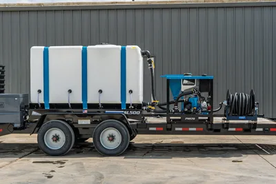 Behnke CBCT2324E-BT-R mud mixing trailer, side view; SL500 tank, Straightline PM170 mixer, hose reel, tandem axle