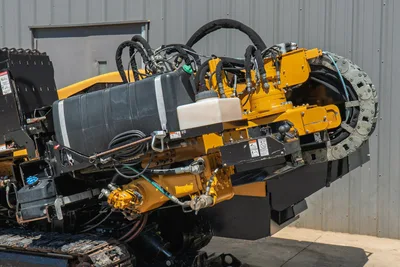 2020 Vermeer D24x40 S3 drill carriage elevated view showing hydraulic hoses, thrust chain, spindle, and yellow frame components