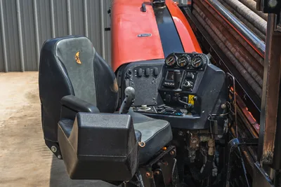 2021 Ditch Witch JT20 operator seat, control console with gauges, joystick, and drill pipe rack visible at right
