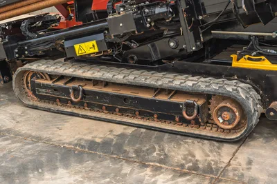 2021 Ditch Witch JT25 lateral view of rubber tracks, drill carriage assembly, and pipe rack feed system in clean condition.