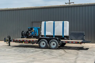 Behnke TBCT2220ET-BT-R HDD mud mixing trailer, 3/4 view, large white water tank, blue SL500 mixer, hose reel, tandem axle