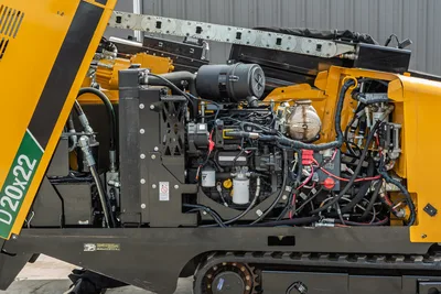 2024 Vermeer D20x22 S3 engine compartment open, showing 74hp diesel engine, hydraulic lines, air filter, and rubber tracks